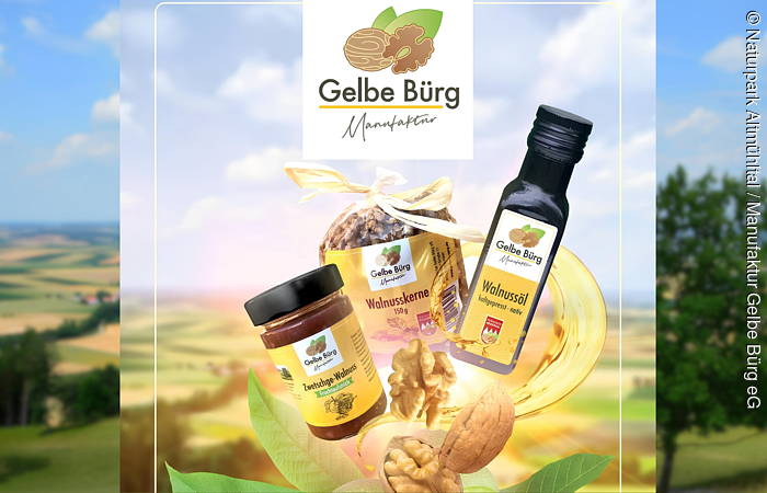 Werbebanner Manufaktur Gelbe Bürg Vor dem Bild einer Walnussplantage wurden mit KI verschiedene Walnussprodukte eingefügt.